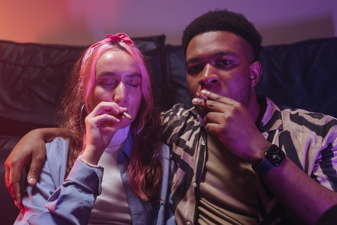 An image of a couple smoking a joint