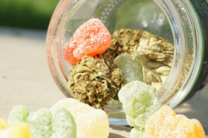 Cannabis gummies spilling out of a jar